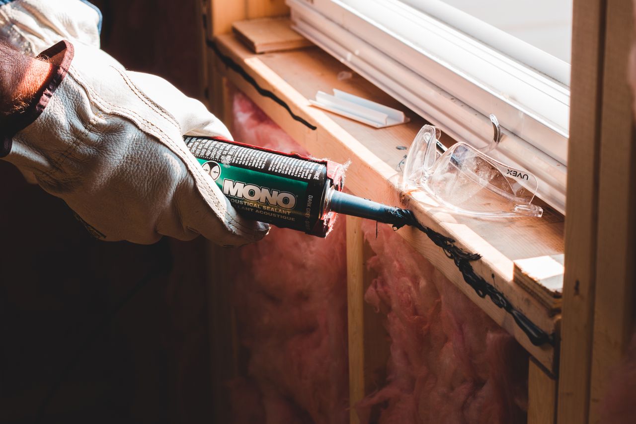 The Art of Drawing Readers In: Your attractive post title goes here Crop unrecognizable workman in glove applying caulk from bottle on seam during window montage work in building
